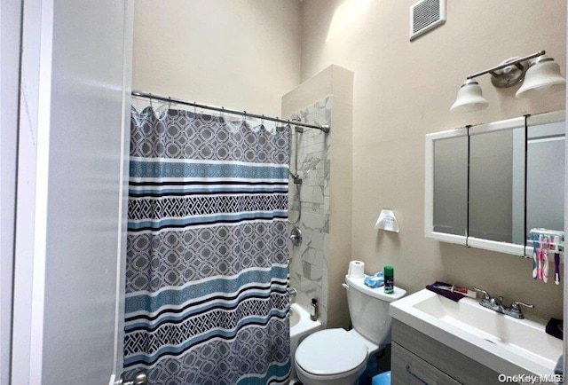 full bathroom featuring vanity, toilet, and shower / bath combo with shower curtain