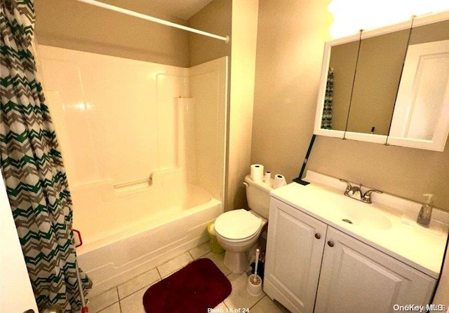 full bathroom featuring tile patterned flooring, vanity, toilet, and shower / bathtub combination with curtain