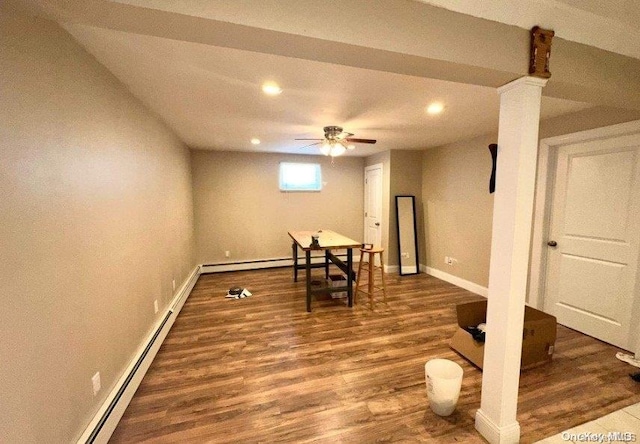 interior space featuring dark hardwood / wood-style floors, baseboard heating, and ceiling fan