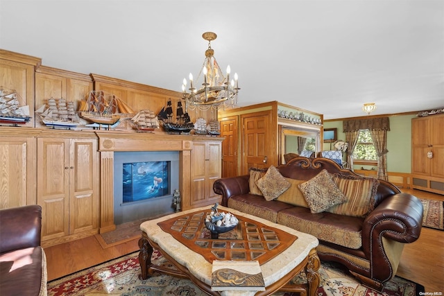 living room featuring light hardwood / wood-style floors and an inviting chandelier