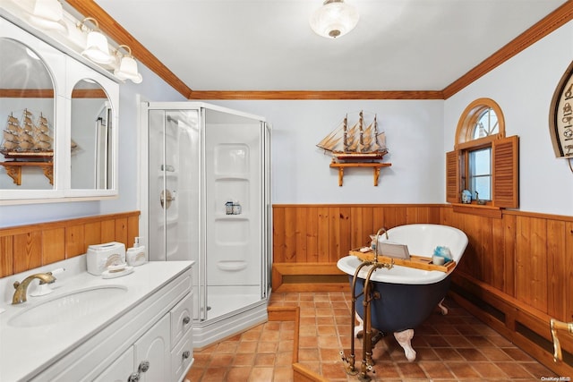 bathroom with plus walk in shower, vanity, wooden walls, and ornamental molding