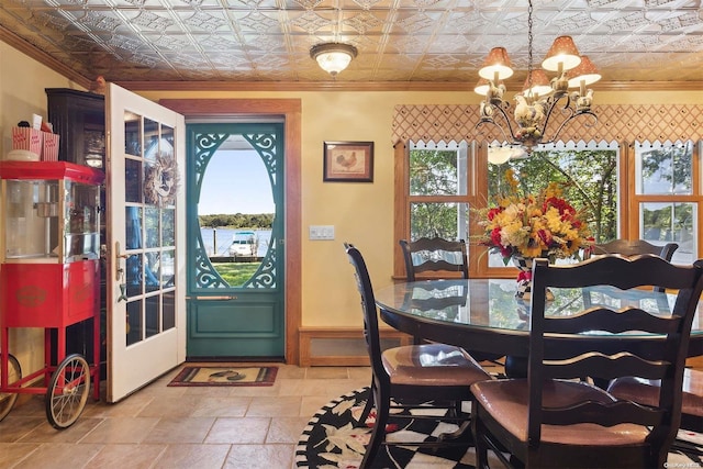 dining area featuring a notable chandelier, a healthy amount of sunlight, and crown molding