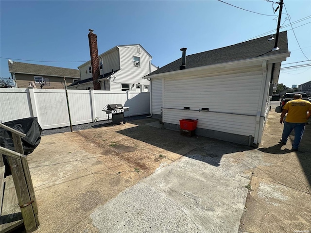 view of side of home featuring a patio area