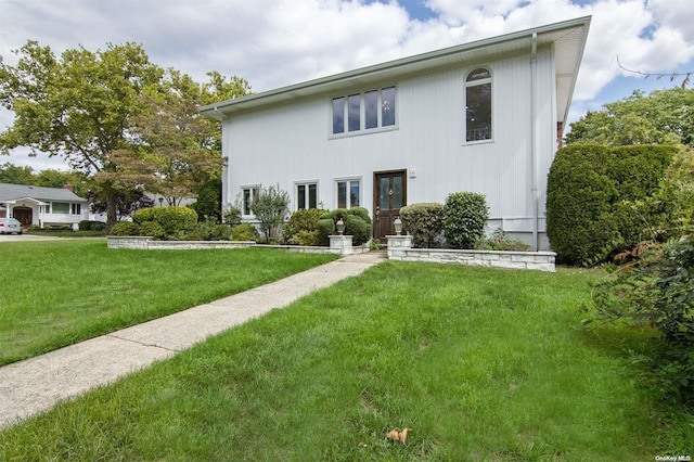 view of front of home with a front lawn