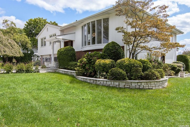 exterior space featuring a front lawn