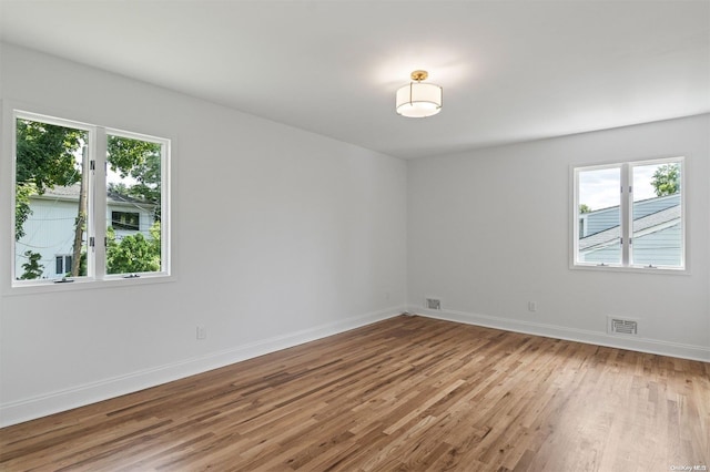 unfurnished room featuring light hardwood / wood-style flooring