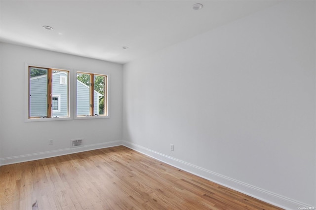 spare room with light hardwood / wood-style flooring