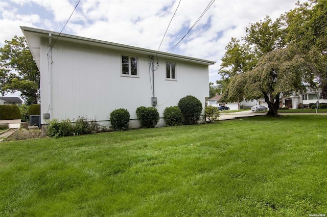 view of property exterior featuring a lawn