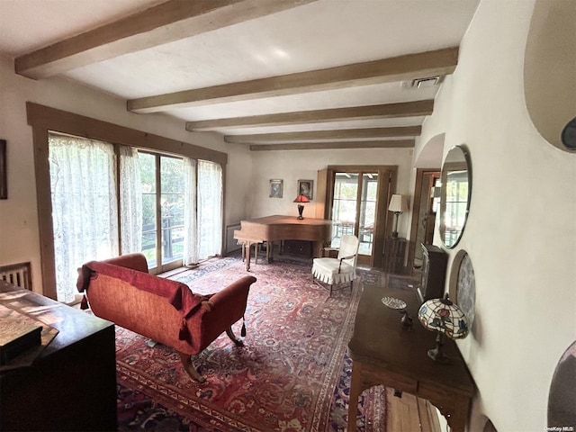 329 Forest Rd, Little Neck, NY 11363 - living room with beamed ceiling, plenty of natural light, and french doors