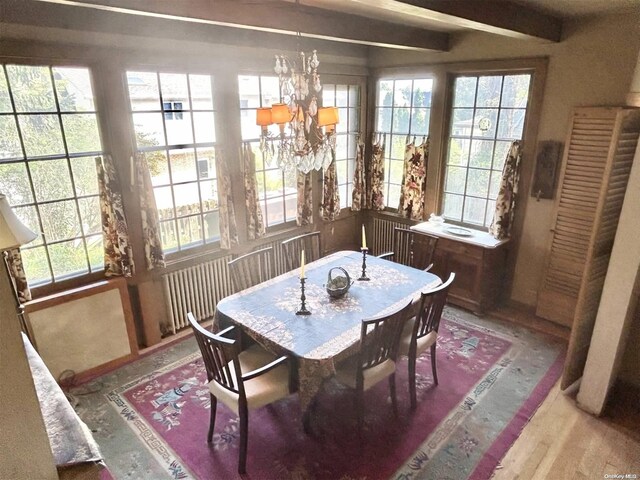 329 Forest Rd, Little Neck, NY 11363 - dining space with a chandelier, beamed ceiling, and wood finished floors