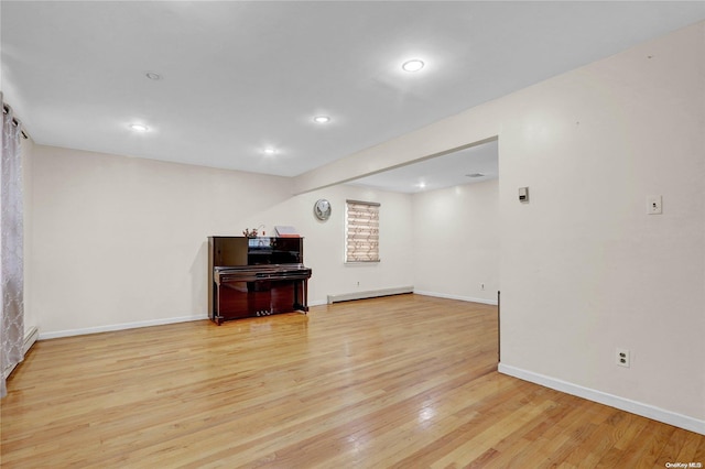 interior space featuring light hardwood / wood-style floors and baseboard heating