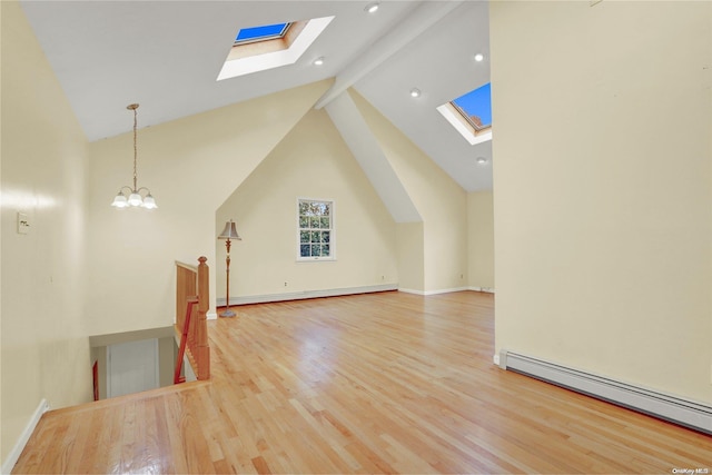 bonus room with light hardwood / wood-style flooring, beamed ceiling, a baseboard radiator, and high vaulted ceiling