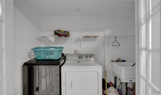 laundry room with washer and dryer