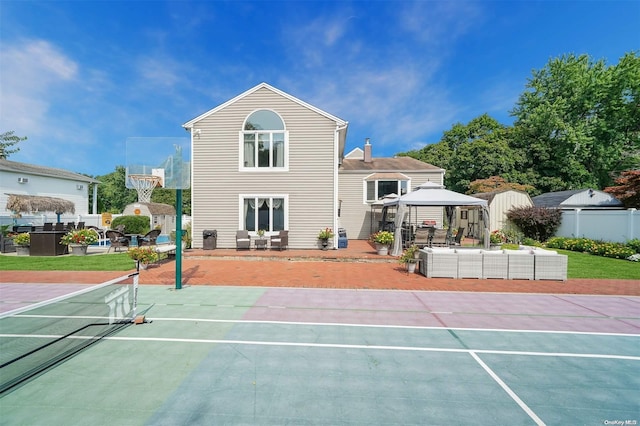 view of tennis court with a gazebo