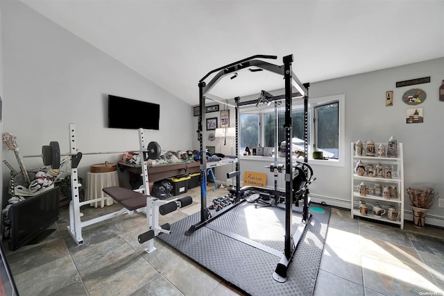 exercise area with vaulted ceiling and a baseboard heating unit