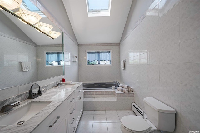 bathroom with baseboard heating, lofted ceiling with skylight, tile patterned floors, and tile walls