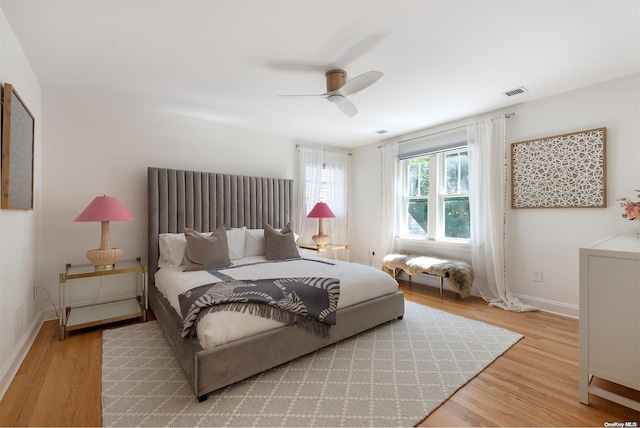 bedroom with hardwood / wood-style floors and ceiling fan