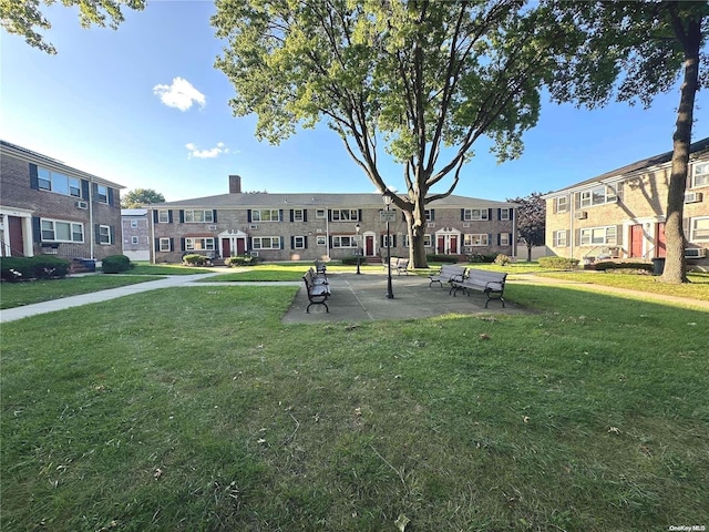 view of property's community with a yard