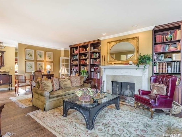 living room featuring hardwood / wood-style flooring and ornamental molding