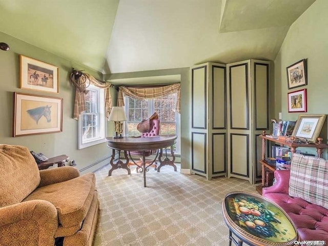 living area with baseboard heating, light colored carpet, and vaulted ceiling