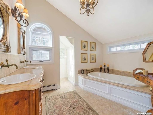 bathroom featuring tile patterned flooring, a baseboard radiator, a healthy amount of sunlight, and vaulted ceiling