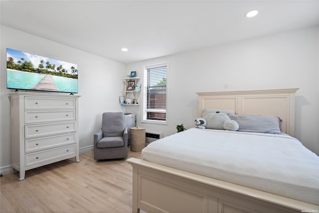 bedroom with light hardwood / wood-style floors