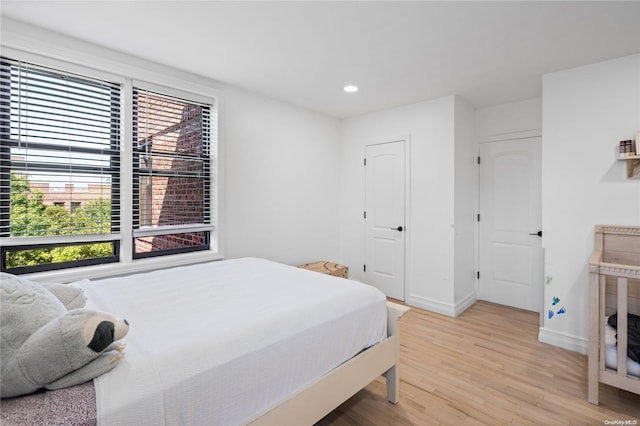 bedroom with light wood-type flooring