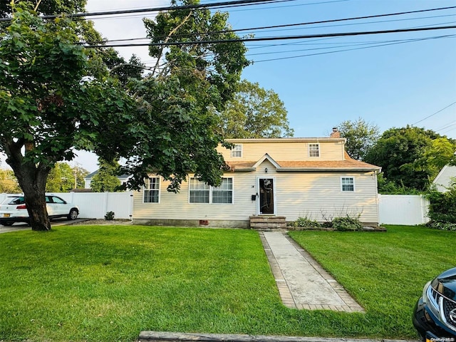 front facade with a front yard