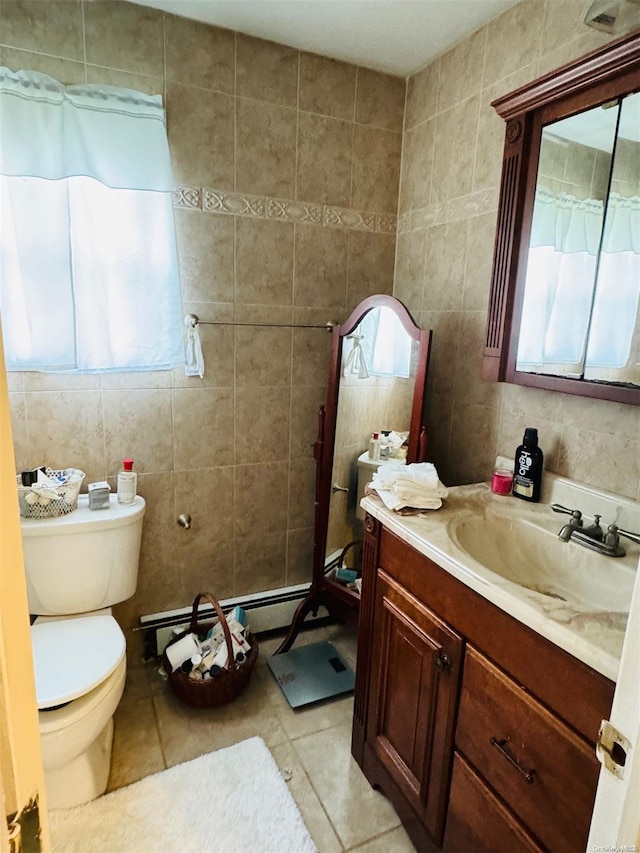 bathroom featuring plenty of natural light and tile walls