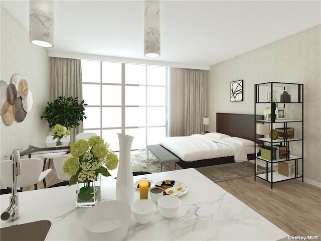 bedroom featuring expansive windows and wood-type flooring