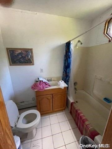 full bathroom with toilet, shower / bath combination with curtain, vanity, and tile patterned floors