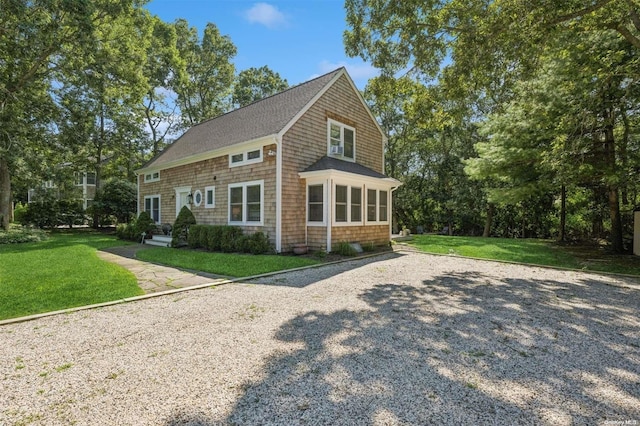 view of side of home featuring a yard