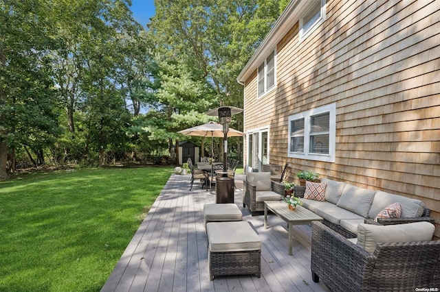 wooden deck featuring an outdoor living space and a yard