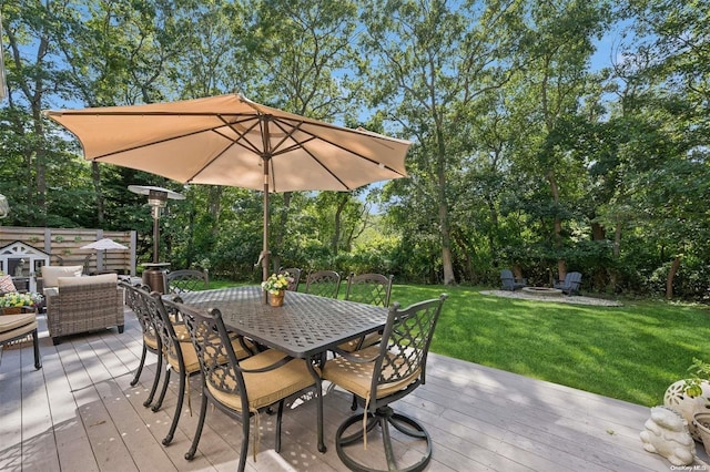 deck with a fire pit and a yard