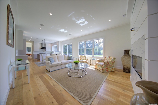 151 Newtown Ln, East Hampton, NY 11937 - living area featuring a premium fireplace, light wood-style floors, recessed lighting, and baseboards