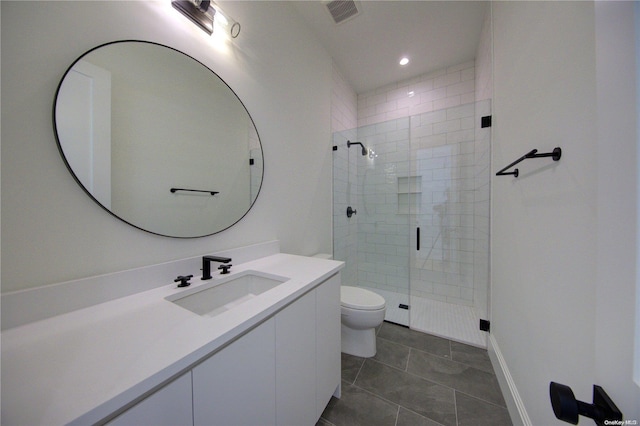 bathroom featuring walk in shower, tile patterned floors, vanity, and toilet