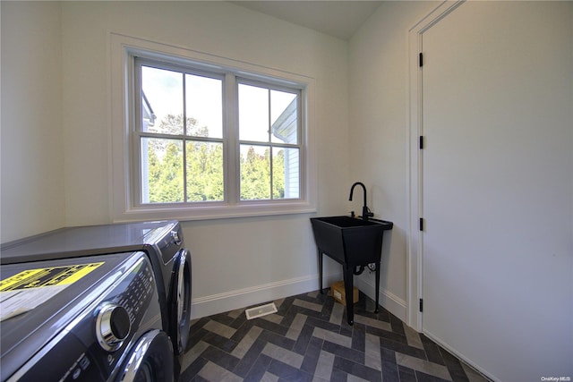 151 Newtown Ln, East Hampton, NY 11937 - laundry area featuring washer and clothes dryer, baseboards, and dark floors