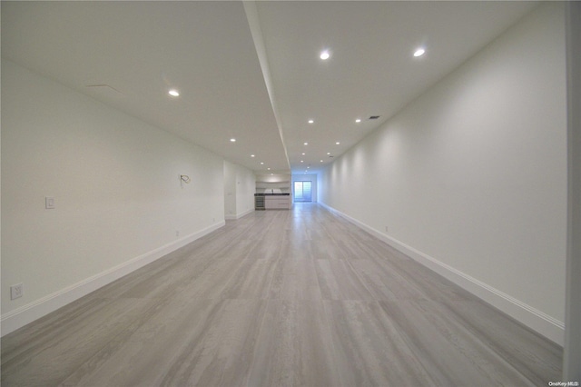 151 Newtown Ln, East Hampton, NY 11937 - unfurnished living room with recessed lighting, light wood finished floors, and baseboards