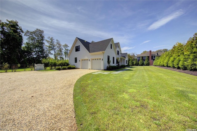 view of property exterior featuring a garage and a yard