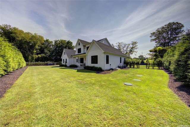 151 Newtown Ln, East Hampton, NY 11937 - view of side of property featuring a lawn