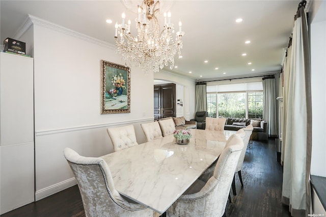 dining space with a chandelier, ornamental molding, and dark wood-type flooring