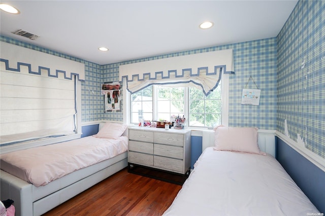 bedroom with dark hardwood / wood-style flooring