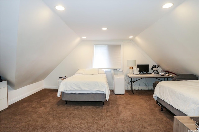 bedroom with vaulted ceiling and dark colored carpet