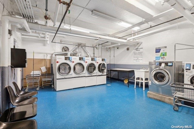 laundry room with washing machine and dryer and sink