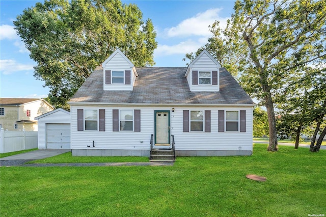 new england style home with a front lawn, an outdoor structure, and a garage