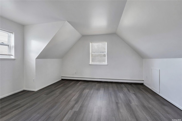 bonus room featuring a baseboard radiator, dark hardwood / wood-style floors, and lofted ceiling