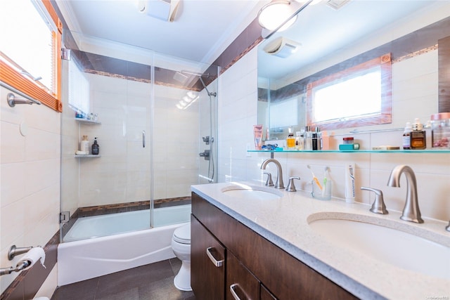 full bathroom featuring combined bath / shower with glass door, backsplash, a wealth of natural light, and ornamental molding