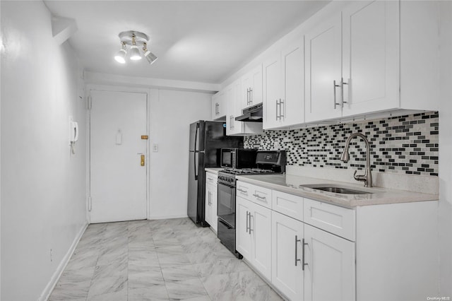 kitchen featuring white cabinets, black gas range, sink, and tasteful backsplash