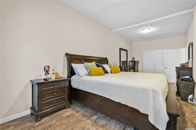 bedroom featuring hardwood / wood-style flooring and a closet