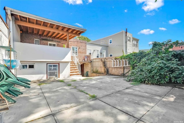 back of house with a patio